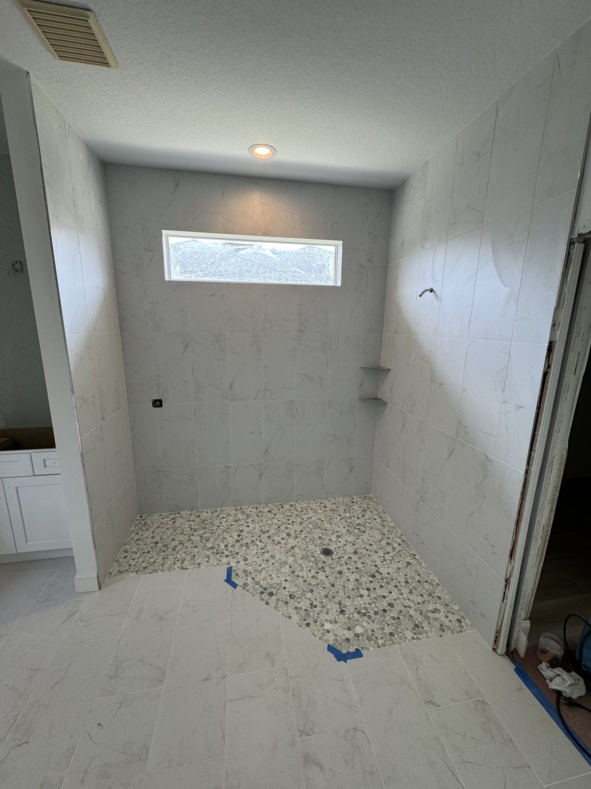Large-format porcelain tile bathroom installation Sarasota FL